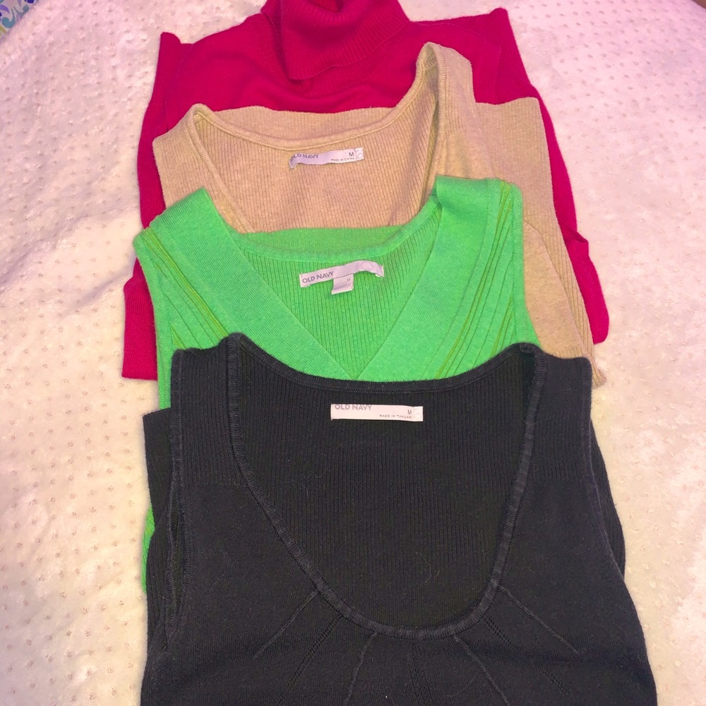 Four sweater vests